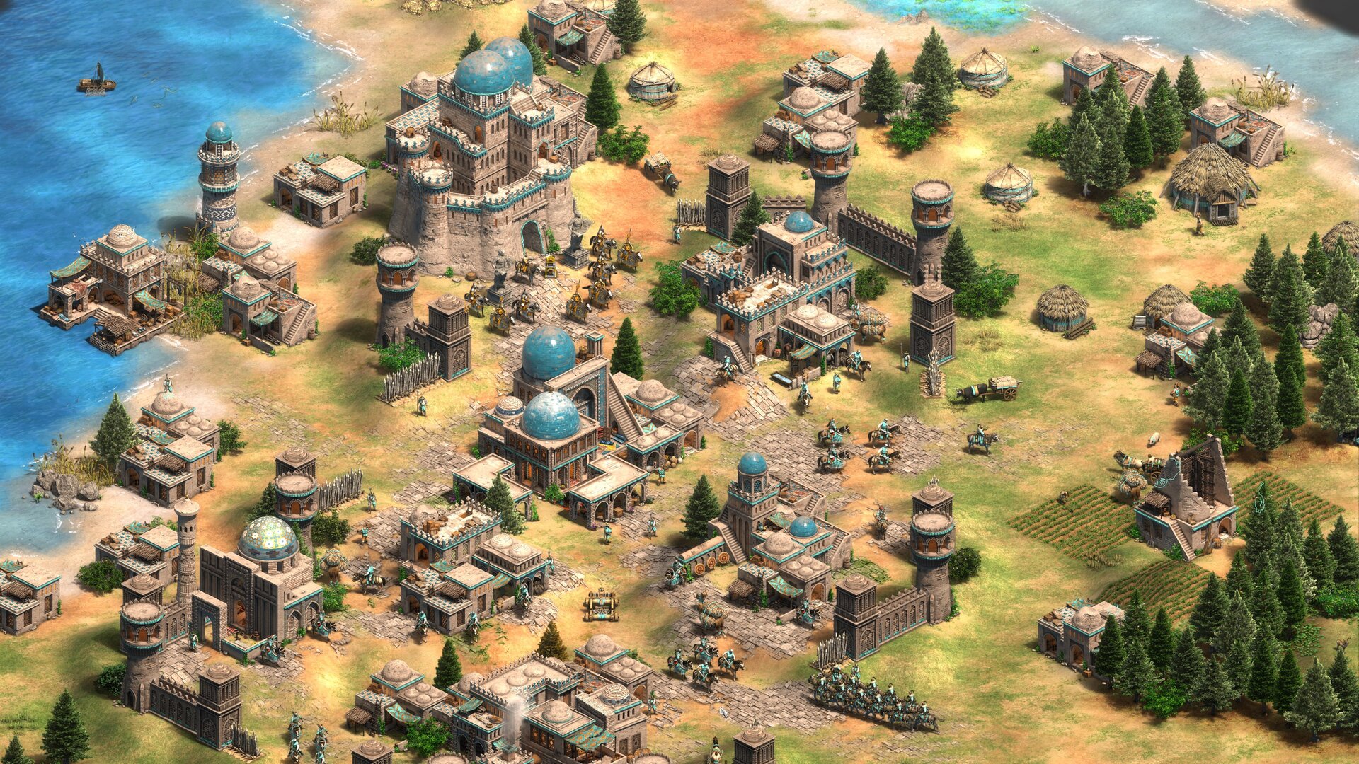 Cidade de Age of Empires II cercada por água, com uma fortaleza, edifícios de cúpulas turquesa, cavalaria, aldeões e onagros distribuídos pelas ruas.